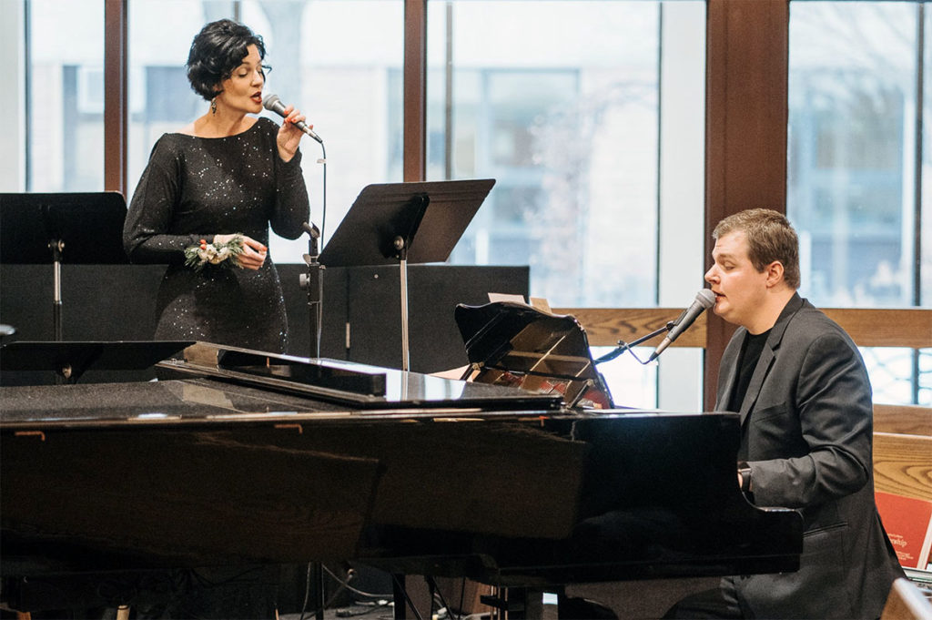 Submitted Image – Garrett Steinberg performs in church with local singer Amy Scruggs Kuch.