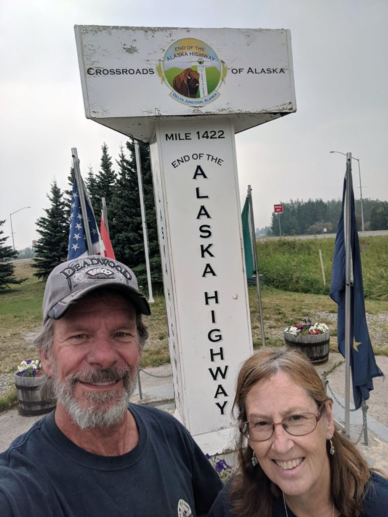 Submitted Image - Dave and Jo Peterson at the end of the Alaskan Highway