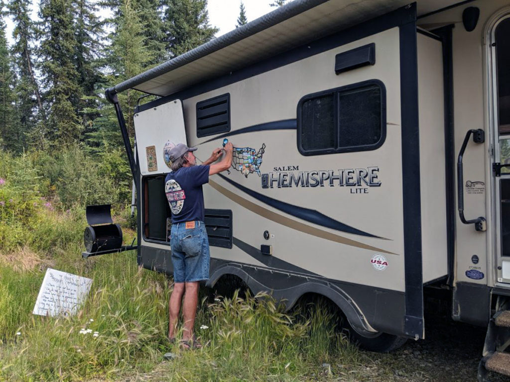 Submitted Image - Dave and Jo Peterson keep track of their travels on a map on the side of their RV