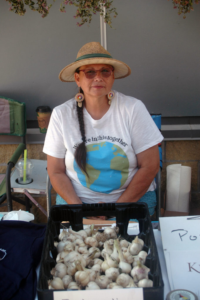 Photo by Don Lipps - Marla C Bull Bear representing her business Honey Lodge at the Grand Opening of Lakota Made's store. Marla is the mother and mentor of Megan Schnitker founder and owner of Lakota Made.