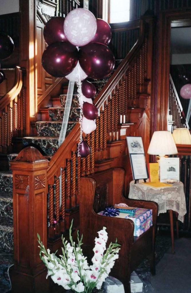 Photo courtesy of Barbara Neilsen- The grand staircase decorated for the YWCA Centennial Anniversary of the Cray House in 1998.