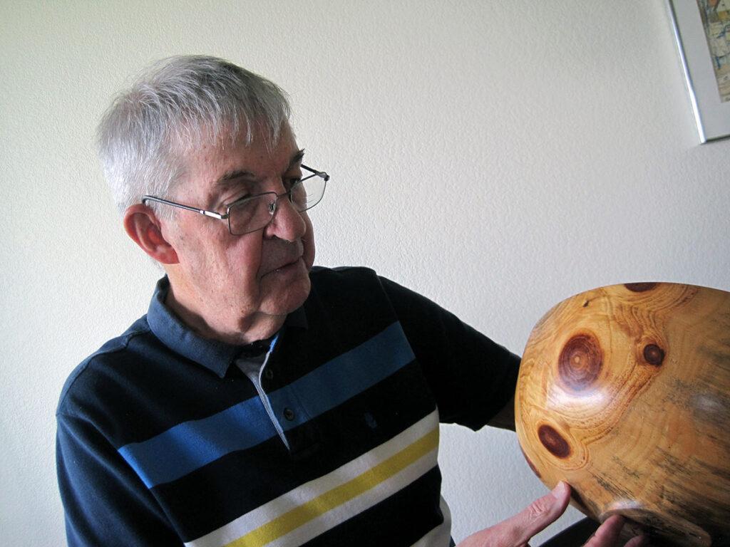 Photo by Carlienne Frisch - Walt Cheever examines the detail on a turned bowl
