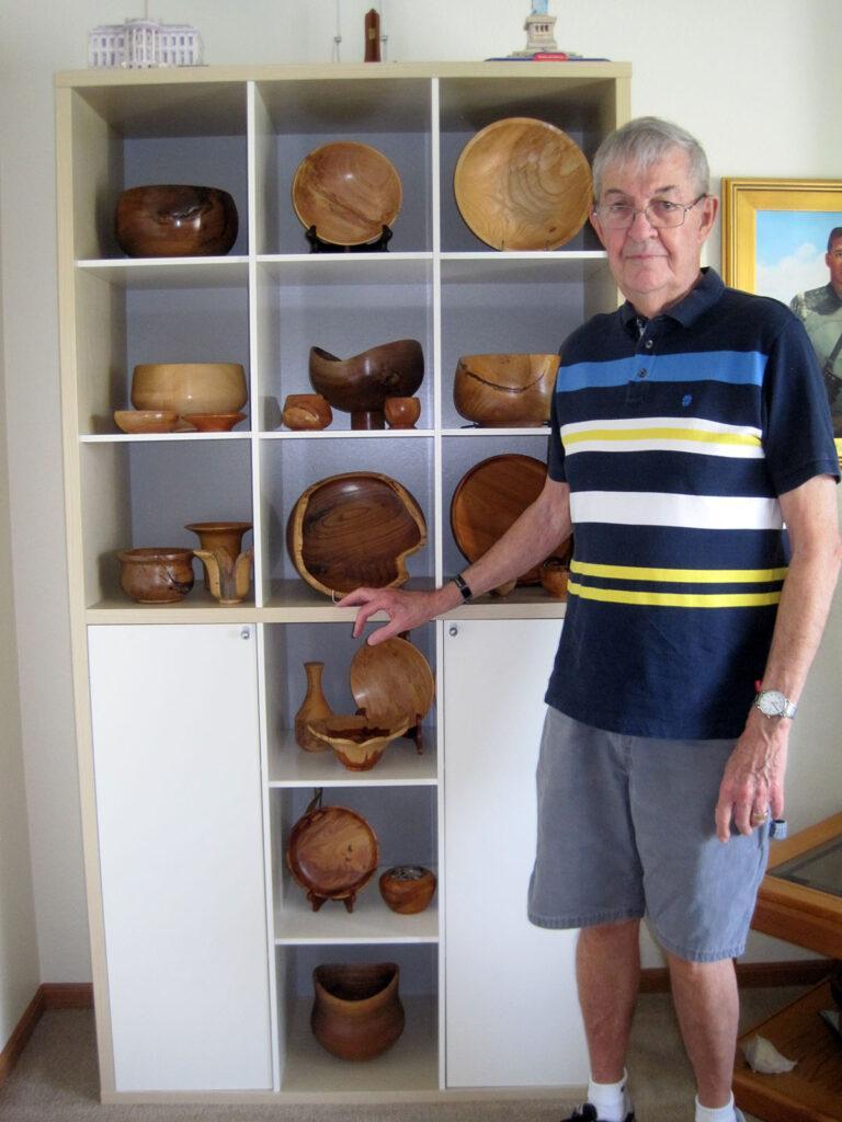 Photo by Carlienne Frisch - Walt Cheever displaying some of his may pieces of art.